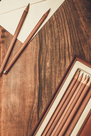 Luxurious charcoal drawing pencils on a wooden tableの写真素材