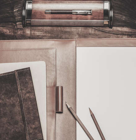 Luxurious writing tools on a wooden tableの写真素材