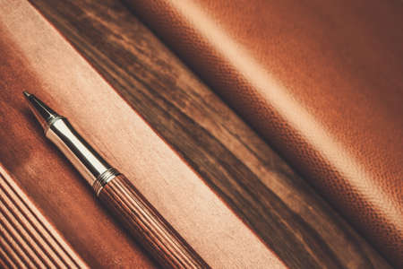 Luxurious rollerball pen on a wooden backgroundの写真素材