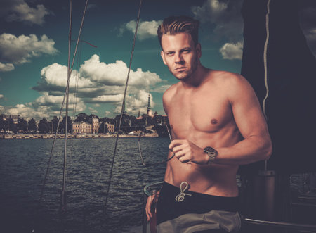 Handsome man on a regattaの写真素材