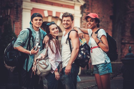 Multiracial friends tourists making selfie in an old cityの写真素材