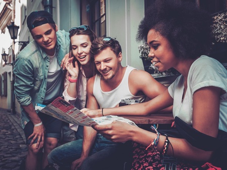 Multiracial friends tourists  in an old cityの写真素材