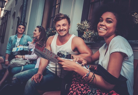 Multiracial friends tourists  in an old cityの写真素材