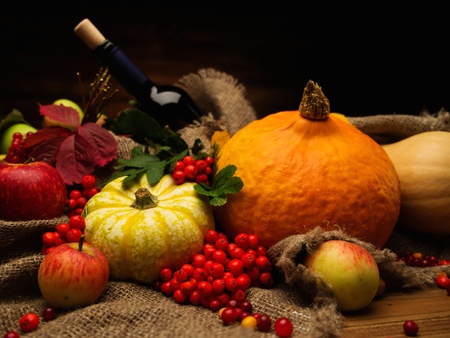 Thanksgiving day autumnal still life with bottle of wineの写真素材