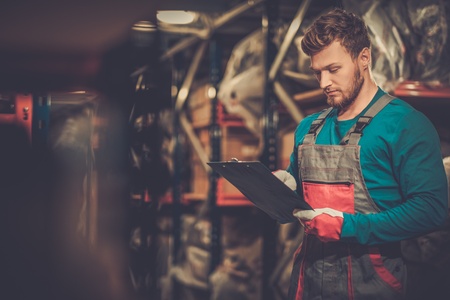 Worker on a automotive spare parts warehouseの写真素材