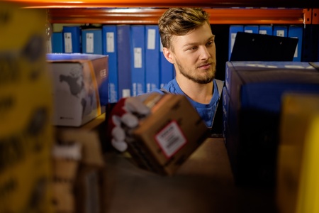 Worker on a automotive spare parts warehouseの写真素材