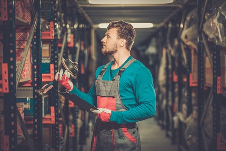 Worker on a automotive spare parts warehouseの写真素材