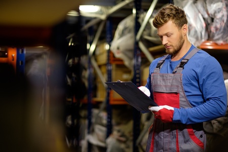 Worker on a automotive spare parts warehouseの写真素材