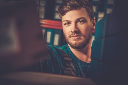 Worker on a automotive spare parts warehouseの写真素材