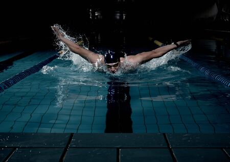 Sportsman swims in a swimming poolの写真素材