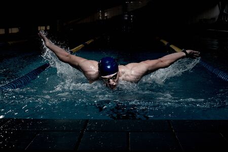 Sportsman swims in a swimming poolの写真素材