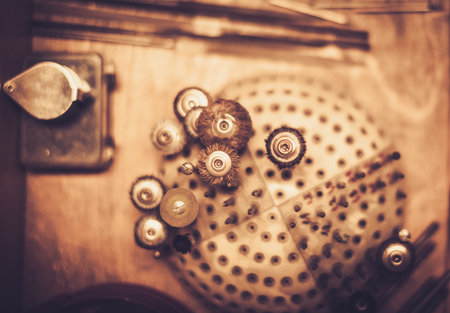 Different goldsmiths tools on the goldsmith workplace.の写真素材