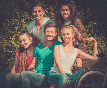 Multi ethnic group of sporty teenage friends in a parkの写真素材