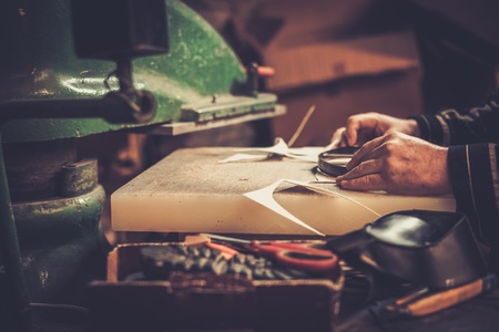 Shoemaker performs shoes in the studio craft.の写真素材