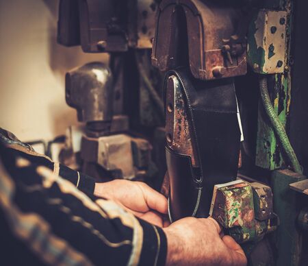 Shoemaker performs shoes in the studio craft professional  machines.の写真素材