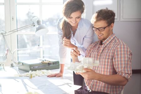 Confident team of engineers working together in a architect studio.