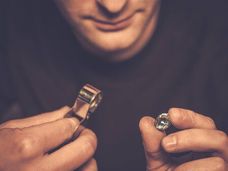 Portrait of a jeweler during the evaluation of jewels.の写真素材