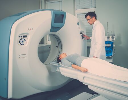 Young woman visiting computed tomography lab