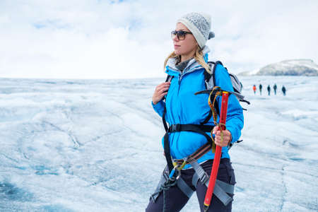 Woman climber standing on Jostedalsbreen glacier. Norway.の写真素材