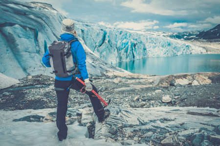 Woman climber standing near Jostedalsbreen glacier. Norway.の写真素材