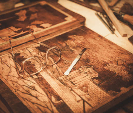 Close-up of the restorer worktable in his workshop.の写真素材