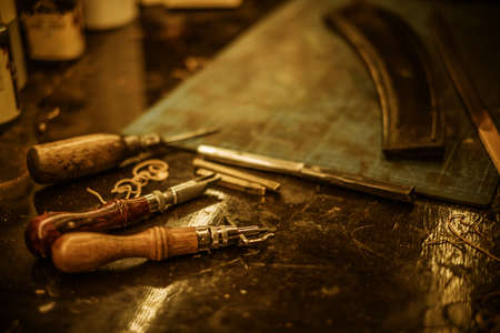 Close-up blacksmith tools for making leather covers.の写真素材