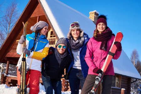 Best friends spend winter holidays at mountain cottage.