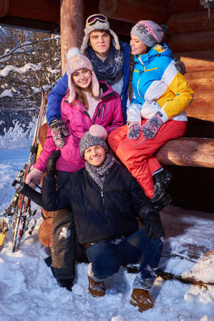 Best friends spending winter holidays at mountain cottage.の写真素材