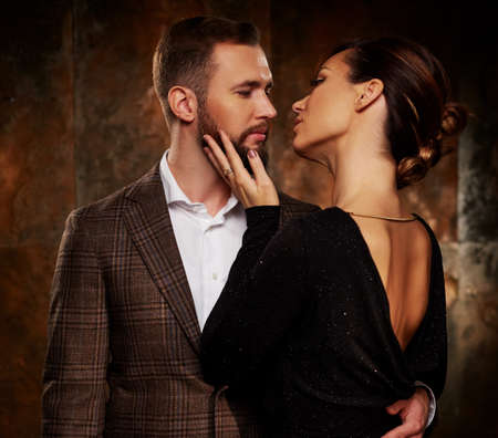 Portrait of well-dressed couple in expression of feelings.の写真素材