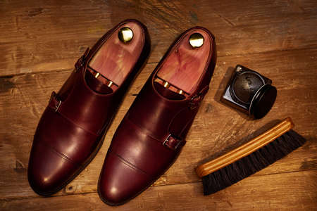 Still life with men's leather shoes and accessories for shoes care.の写真素材