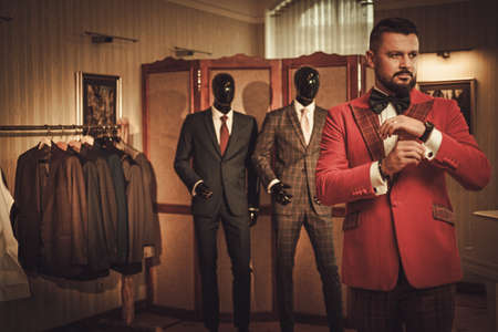 Extravagant stylish man in tailor studio.