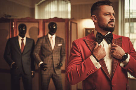 Extravagant stylish man in tailor studio.