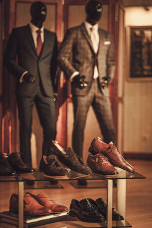 Custom made shoes and suits in tailor studio.の写真素材