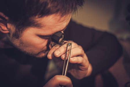 Jeweler during the evaluation of jewels.