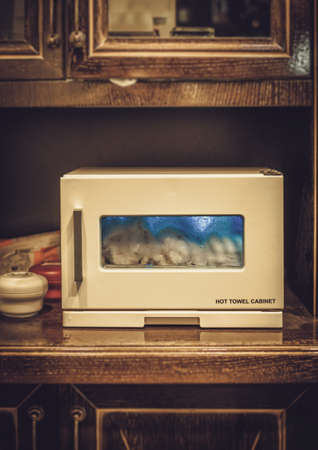 Hot towel cabinet in barbershopの写真素材