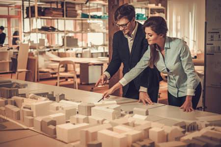 Confident team of engineers working together in a architect studio.の写真素材