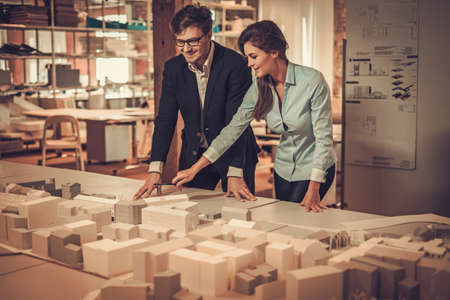 Confident team of engineers working together in a architect studio.の写真素材