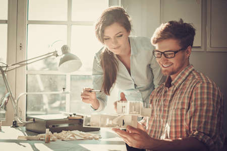 Confident team of engineers working together in a architect studio.の写真素材