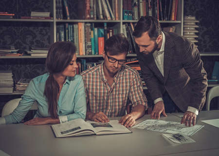 Confident team of engineers working together in a architect studio.の写真素材