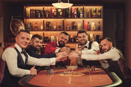Group of upper class men toasting in gentlemens club