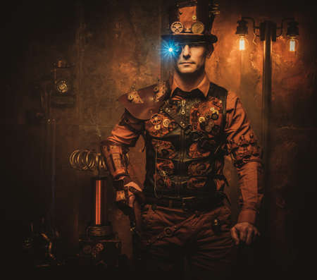 Steampunk man with gun on vintage steampunk backgroundの写真素材