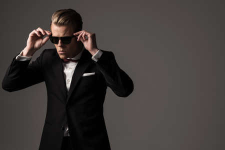 Confident sharp dressed man in black suitの写真素材