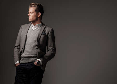 Confident sharp dressed man in grey jacket