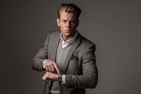 Confident sharp dressed man in grey jacketの写真素材