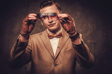 Sharp dressed man wearing jacket and bow tieの写真素材