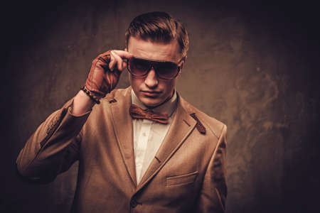 Sharp dressed man wearing jacket and bow tieの写真素材