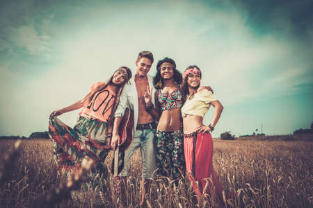 Multinational hippie friends in a wheat field