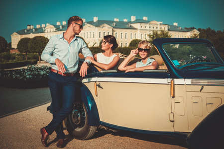 Wealthy friends near classic convertibleの写真素材