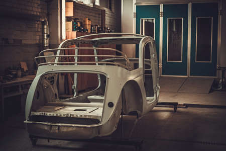 Classic car bodykit parts in painting workshop.の写真素材