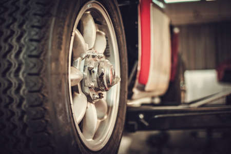 Wheel of classic car in a workshopの写真素材